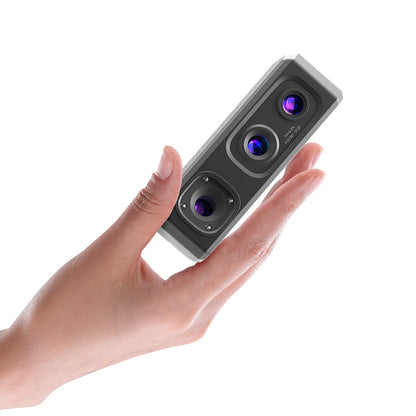 Scanner tenu dans une main